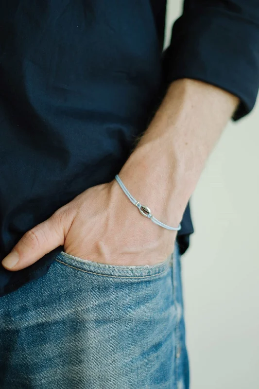 Men's bracelet with silver cowrie shell charm, light blue cord, gift for him