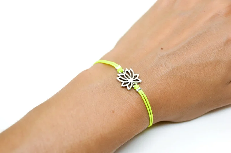 Neon yellow cord bracelet with silver lotus charm, yoga jewelry