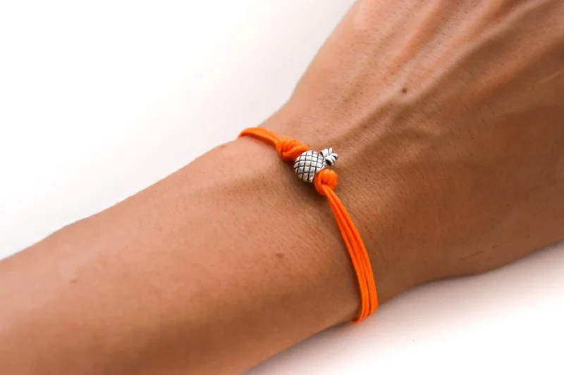 Silver pineapple charm bead bracelet with orange cord, tropical jewelry