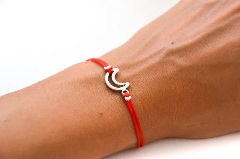 Red cord bracelet with a silver crescent moon charm, gift for her