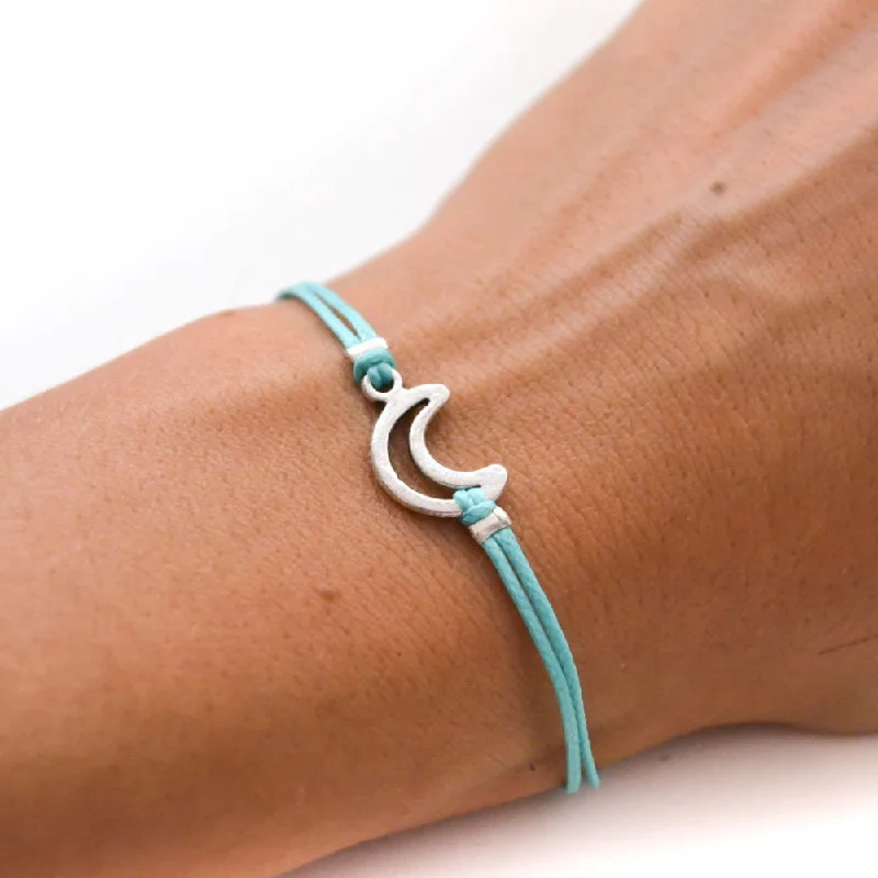 Turquoise cord bracelet with a silver crescent moon charm, gift for her