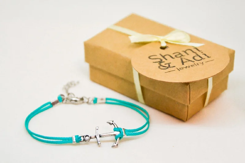 Turquoise cord bracelet with a silver plated anchor charm, nautical gift for her