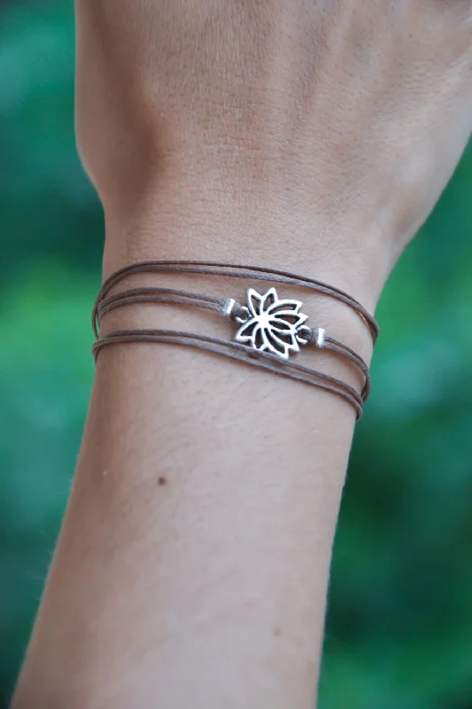 Wrapped bracelet with silver tone Lotus charm, brown cord, custom festival jewelry