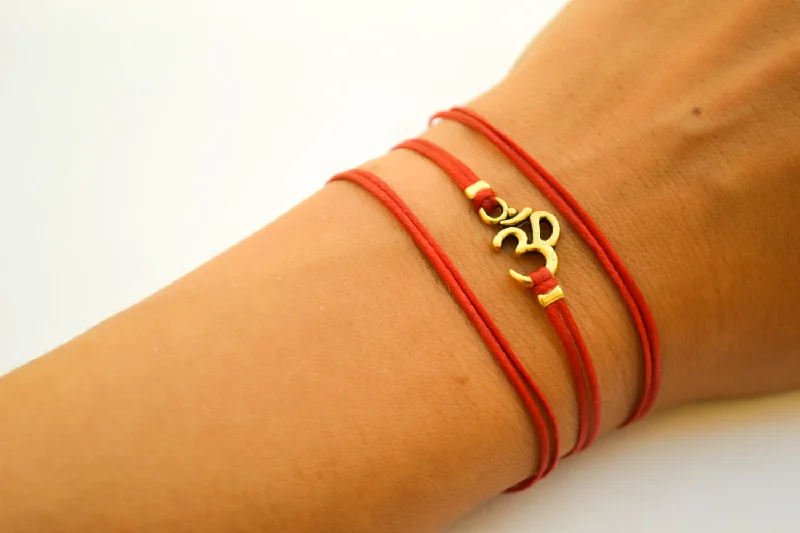 Wrapped red bracelet with gold tone Om charm, yoga jewelry for her